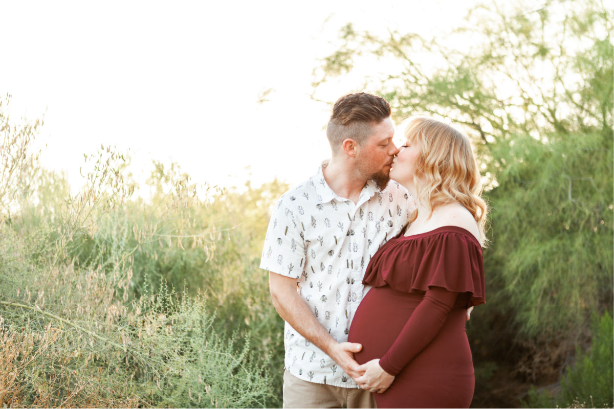 Pregnant mom and dad in a desert sunset maternity session. Taken at the Gilbert Riparian Preserve.