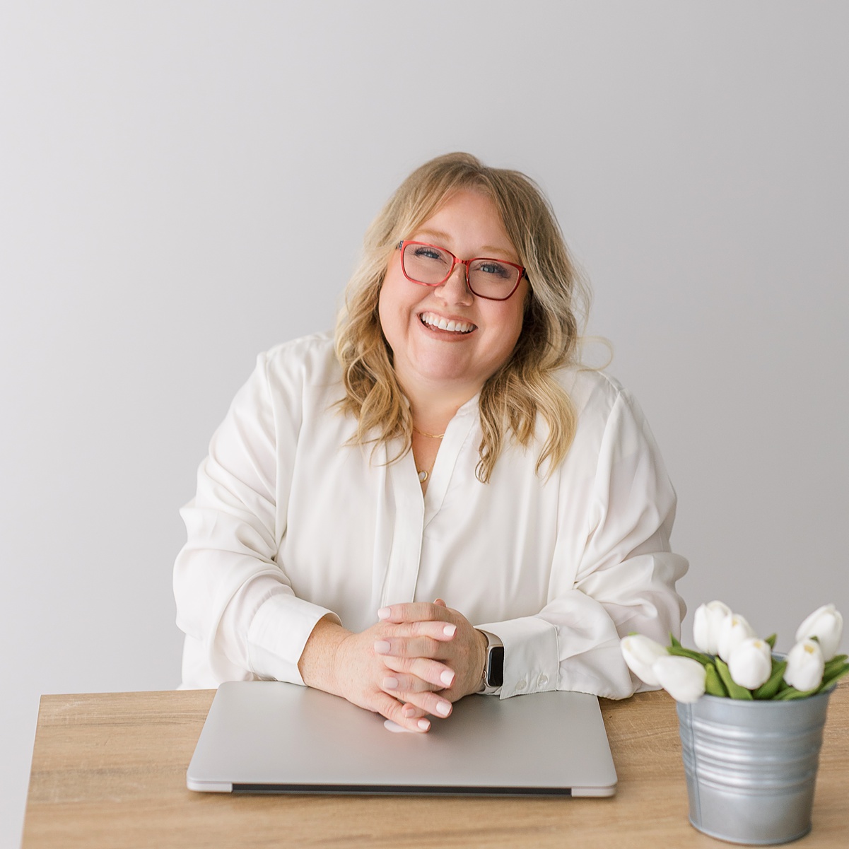 Mesa newborn photographer Sally Whetten in white studio.