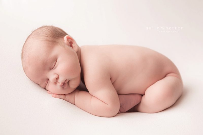 scottsdale arizona newborn pictures, baby boy sleeping, baby pictures on white fur, newborn on white blanket photos