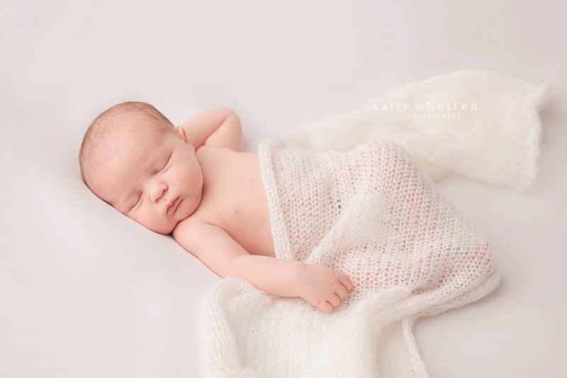 scottsdale arizona newborn pictures, baby boy sleeping, baby pictures on white fur, newborn on white blanket photos