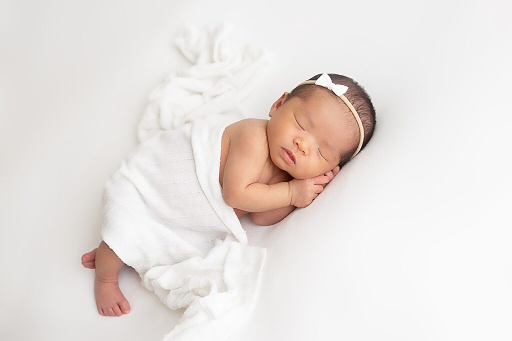 Peaceful newborn baby girl photo captured by Mesa newborn photographer